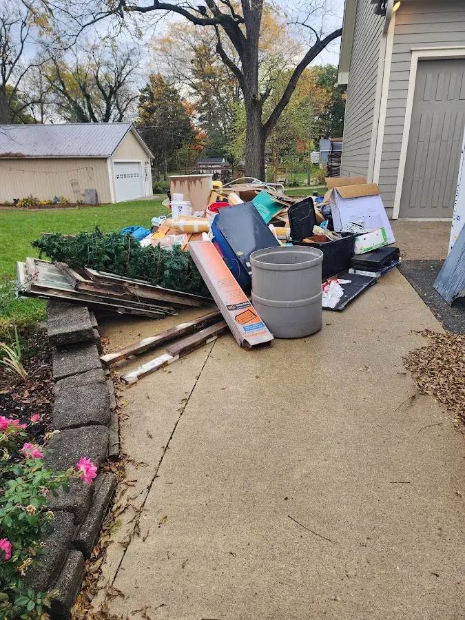 Dumpster being loaded with debris for 30 Yard Dumpster Rental in Elmira